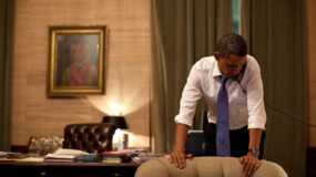 Photo of President Barack Obama at work on the phone.